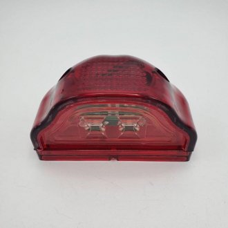 Ліхтар підсвічування номера в червоному напівпрозорому корпусі 24V Турция L0064R (фото 1)