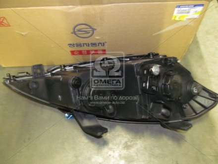 Фара левая SSANGYONG 8310309102